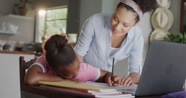 Smiling Mother Helping Daughter With Online Homeschooling Work - Download Free Stock Images Pikwizard.com