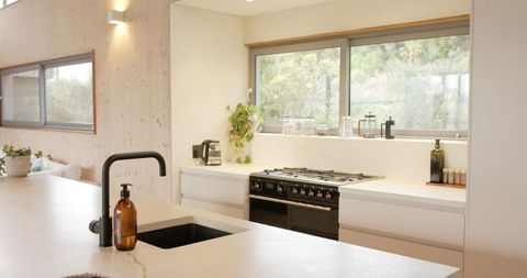 Modern Kitchen Interior with Luxury Island and Garden View
