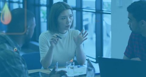 Professional Businesswoman Leading Discussion in Modern Office Meeting