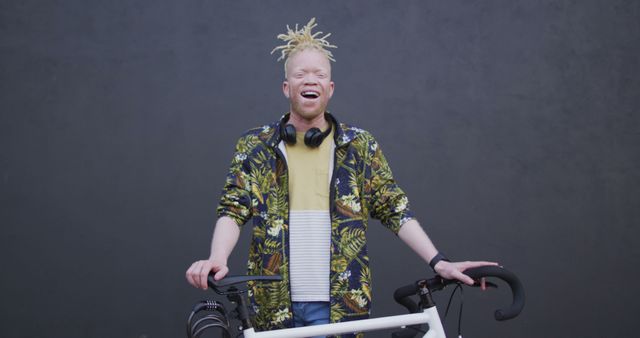 Smiling Man with Bike Headphones Tropical Jacket Urban Background - Download Free Stock Images Pikwizard.com