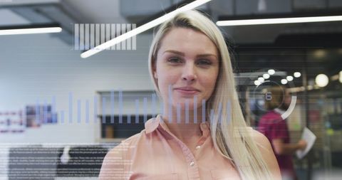 Businesswoman Engages with Digital Data Display in Modern Office