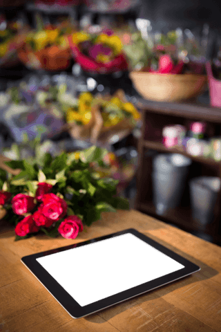 transparent digital tablet with red flowers in flower shop - Download Free Stock Videos Pikwizard.com