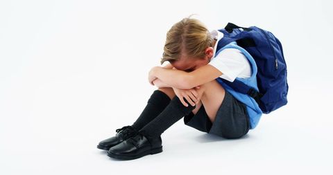 Sad Schoolboy Sitting with Backpack and Head on Knees - Download Free Stock Images Pikwizard.com