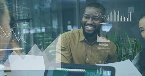 Smiling Facilitator in Team Meeting with Digital Insights