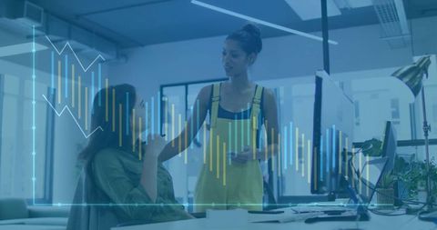 Coworkers discussing in modern office with barchart overlay
