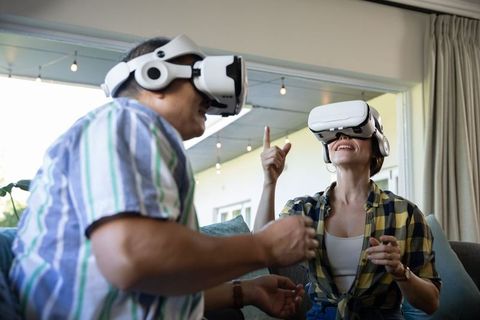 Senior Couple Enjoying Virtual Reality in Cozy Living Room