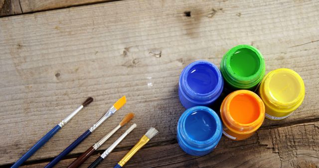 Acrylic Paints and Brushes on Wooden Table for Creative Projects - Download Free Stock Photos Pikwizard.com