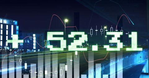 Financial data displayed over modern cityscape at night