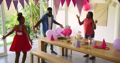 Family Enjoying Birthday Celebration with Festive Decorations