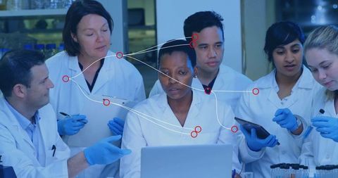 Diverse Scientists Collaborating with Technology in Laboratory