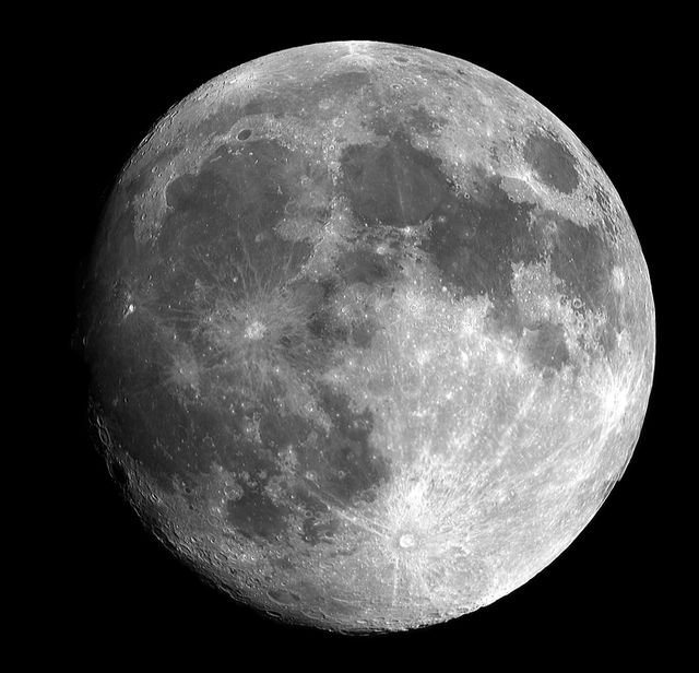 Captures detailed image of the full moon with visible craters and lunar surface features in a dark night sky. Ideal for astronomy enthusiasts, educational purposes, space-themed presentations, and backgrounds for science-related content.