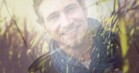 Double exposure of smiling man in nature setting