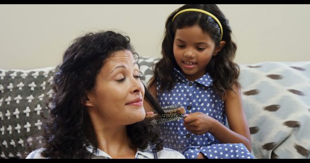 Daughter Brushing Mother's Hair in Living Room - Download Free Stock Images Pikwizard.com