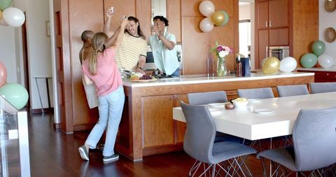 Friends Enjoying Casual Gathering in Modern Kitchen