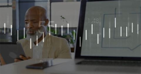 Senior business analyst utilizing tablet with digital financial data