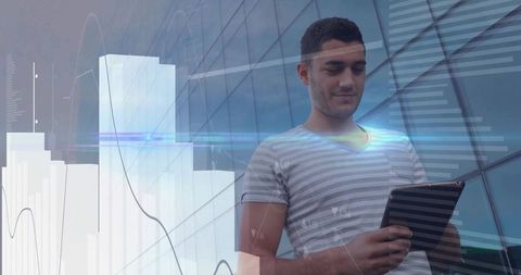 Young Man Using Tablet with Futuristic Data Overlay over City Glass Facade