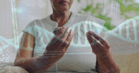 Senior woman holding medication bottle inspecting prescription with dna hologram overlay
