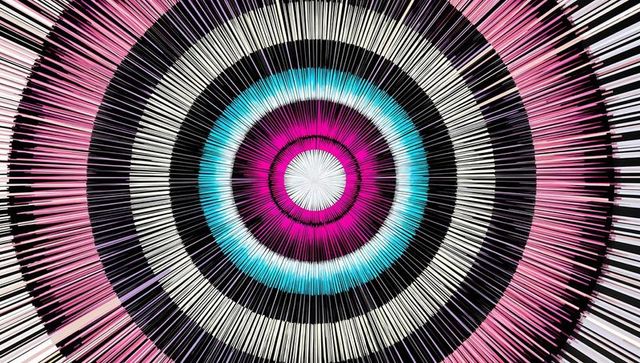 Pulsing radial burst with magenta and cyan rings radiating spiky geometric pattern