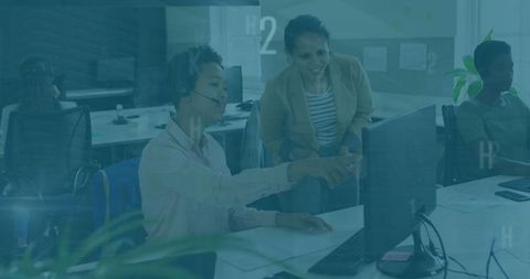 Support agent engaging with supervisor in collaborative office environment