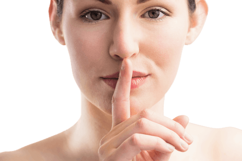 Transparent woman gesturing silence with finger on lips