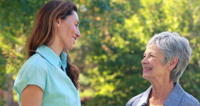 Senior Woman and Younger Female Friend Enjoying Outdoor Conversation - Download Free Stock Images Pikwizard.com