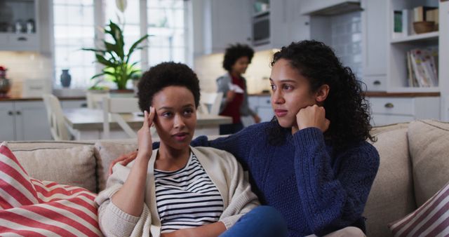 Concerned women having conversation on sofa in modern home - Download Free Stock Images Pikwizard.com