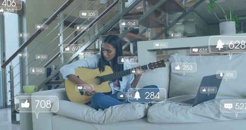 Woman Engaging in Social Media While Playing Guitar at Home
