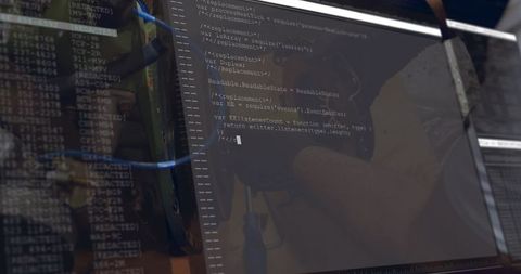 Technician Fixing Server Hardware Displaying Code Overlay with Blue LAN Cables