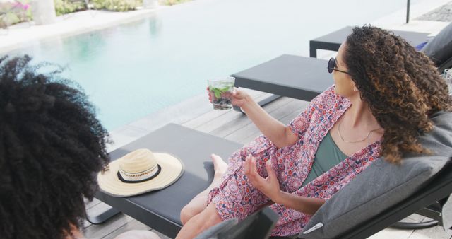 Women Relaxing Poolside Holding Drink at Luxury Resort - Download Free Stock Images Pikwizard.com