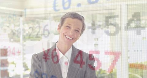 Businesswoman Smiling with Stock Market Reflections - Download Free Stock Images Pikwizard.com