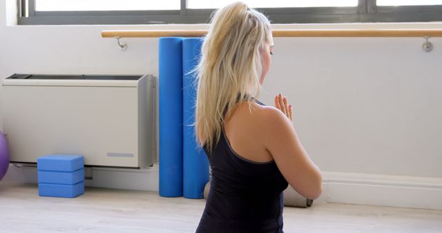 Woman Practicing Yoga Meditation in Bright Studio - Download Free Stock Images Pikwizard.com