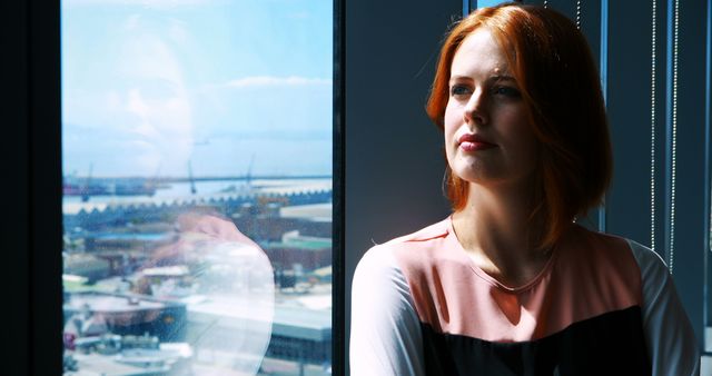 Confident Businesswoman Looking Through Office Window - Download Free Stock Images Pikwizard.com