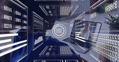 Holographic data dashboard floating over laptop reflecting remote team in modern workspace