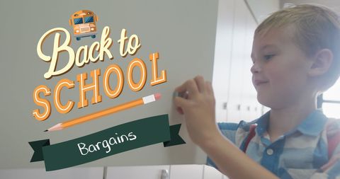 Happy schoolboy celebrating back to school bargains