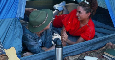 Happy Couple Relaxing Inside Cozy Camping Tent