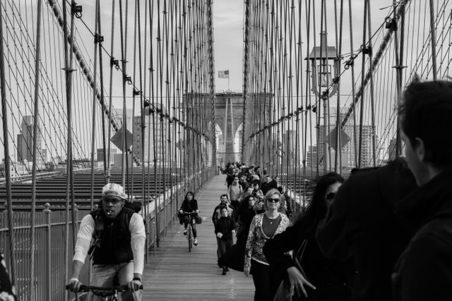 Grayscale Photo of People Walking on a Bridge during Daytime - Download Free Stock Photos Pikwizard.com