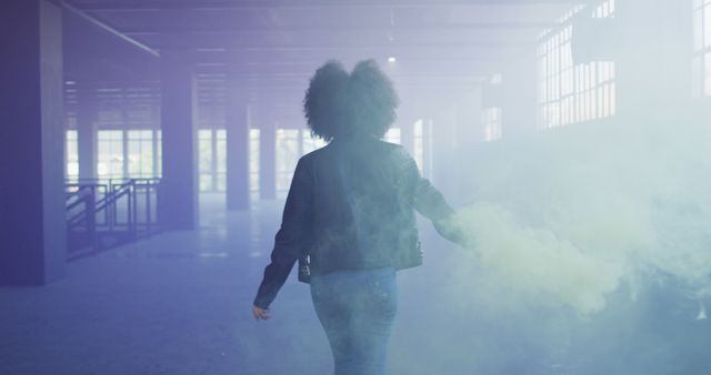 Person in Smoky Abandoned Building with Colorful Haze - Download Free Stock Images Pikwizard.com