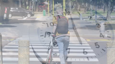Time Management Concept with Bicyclist on Urban Road