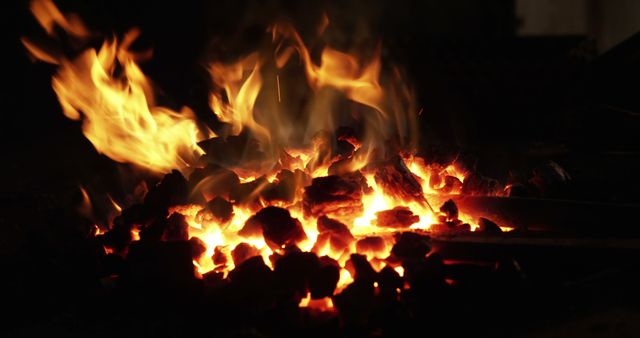 Burning fire at fireplace for blacksmith work in workshop 4k