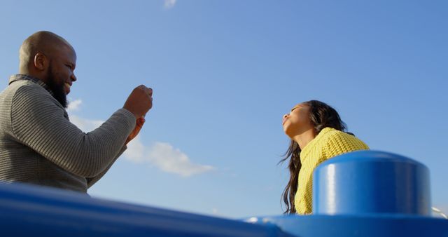 Happy Couple Taking Photos Outdoors on a Sunny Day - Download Free Stock Images Pikwizard.com