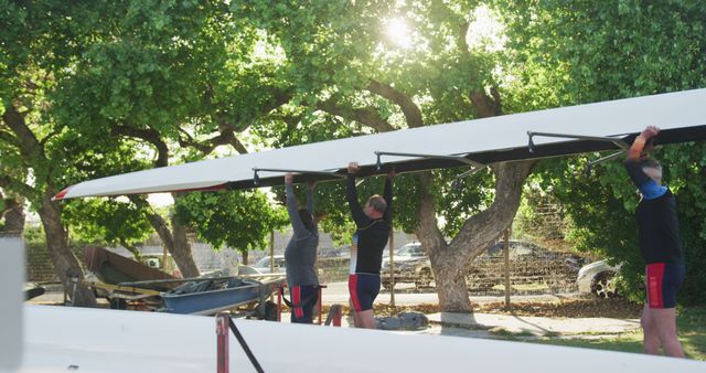 Team of Rowers Carrying Shell Boat at Sunrise - Download Free Stock Images Pikwizard.com