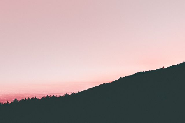 Serene Pink Sunset Over Mountain Silhouette - Download Free Stock Photos Pikwizard.com