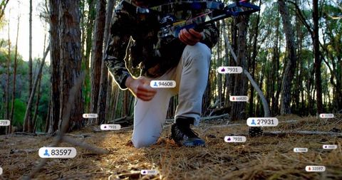Digital Metrics Overlay with Hunter in Pine Forest with Bow