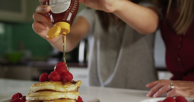 Drizzling Honey on Pancakes with Fresh Raspberries - Download Free Stock Images Pikwizard.com