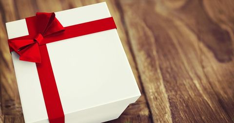 Gift Wrapped White Box on Wooden Table with Red Ribbon - Download Free Stock Images Pikwizard.com