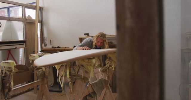 Craftsperson Shaping Surfboard in Workshop - Download Free Stock Images Pikwizard.com