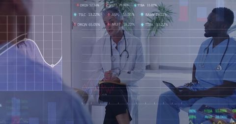 Medical Professionals Analyzing Digital Data in Modern Consultation