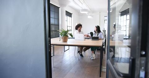 Colleagues teamwork high-five modern office collaboration