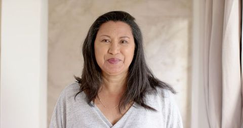 Confident woman in home interior with minimalistic style