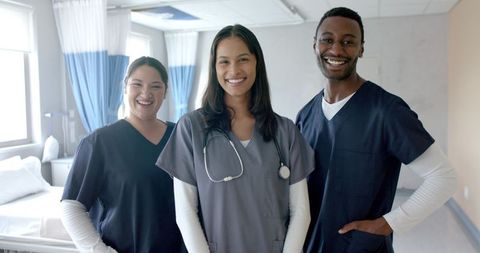 Diverse Medical Team Smiling in Hospital Ward